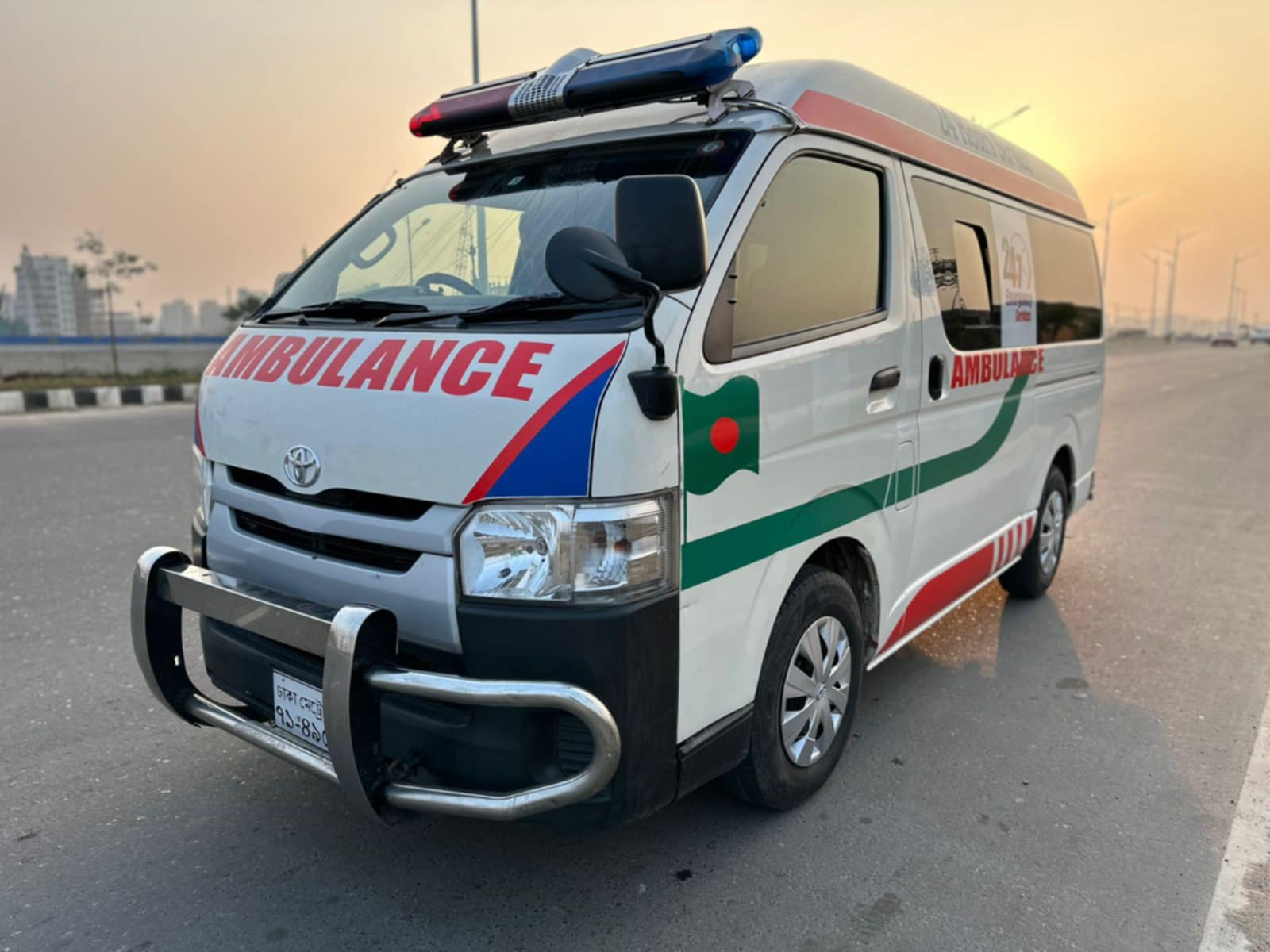 An ac ambulance standing on a road
