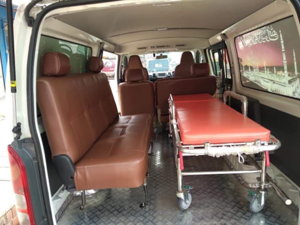 Ambulance Service Gulshan stretcher and seating arrangement inside vehicle.